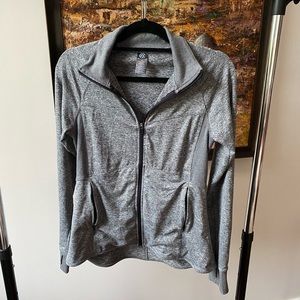 Grey, Champion running zip-up, w/ thumb holes and zippered pockets.